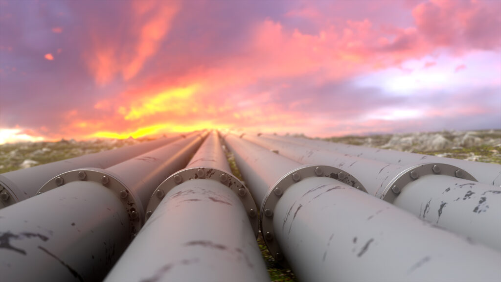 industrial pipelines and valves on sunset sky background, banner.