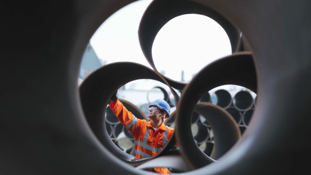 man checking pipes