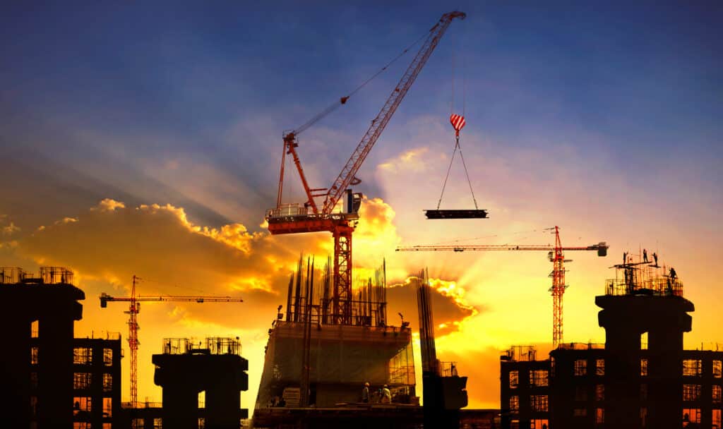 big-crane-and-building-construction-against-beautiful-dusky-sky-use-for-construction-industry-and-engineering